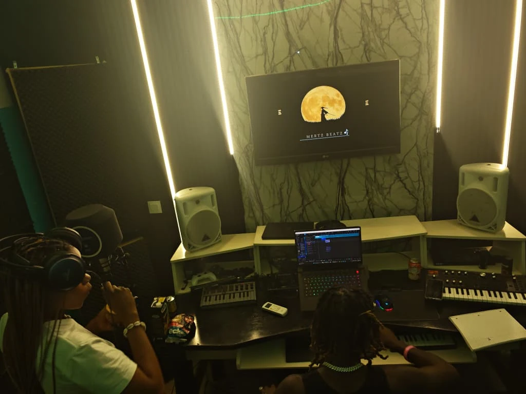 Artists working inside Mertz Beatz recording studio in The Gambia